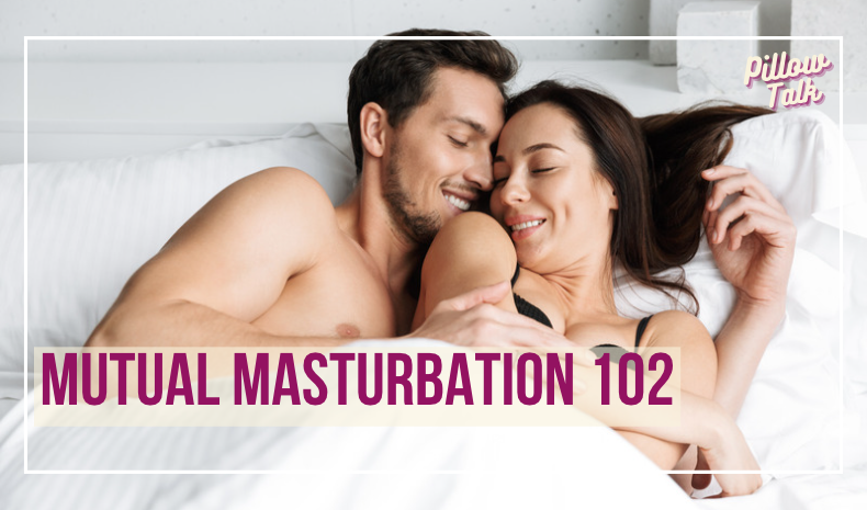 Couple laying in bed, on their backs, turned in towards each other, embracing. A white frame surrounds image, text in magenta "Mutual Masturbation 102". "Pillow Talk" in magenta cursive is in upper right corner.